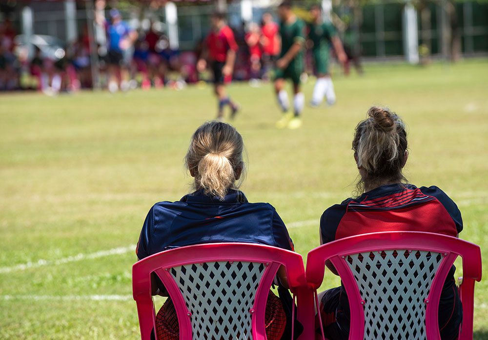 People watching youth sports